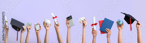 Tableau sur toile Female hands holding piggy bank, graduation cap, diplomas and money on lilac background