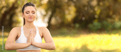 Young woman practicing yoga outdoors © Pixel-Shot