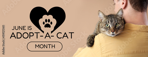 Young man with cute cat on ...