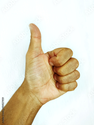 Closeup of black male hand showing thumbs up sign. ok sign.
