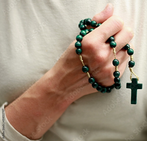 praying to god with cross and hands together with black background with people stock image stock photo