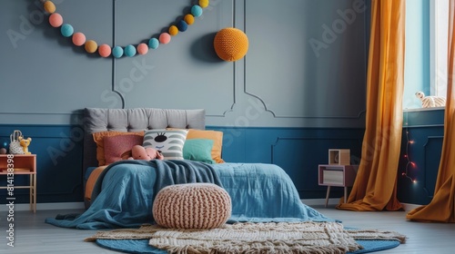 A charming and cozy kid’s room featuring a stylish bed, blue wall, braided pouf, round rug, books, a colorful garland, and gray curtains photo