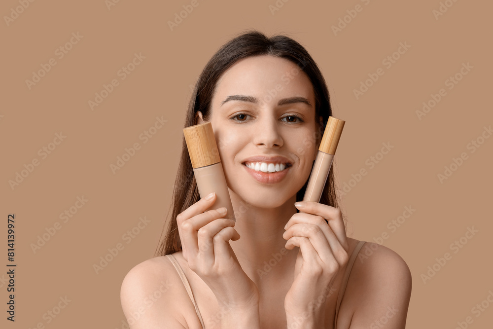 Portrait of beautiful young woman with foundation and concealer on brown background Portrait of beautiful young woman with foundation and concealer on brown background