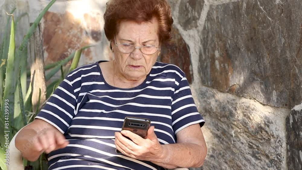 senior woman with mobile phone reading message senior woman with mobile phone reading message