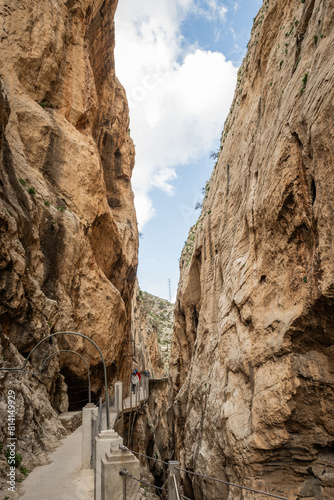 hiking trail caminito del rey, kings walkway, in Malaga Spain. narrow footpath leads through natural beauty mountain range cliff faces of gaitanes gorge. hisotric landmark popular tourist attraction