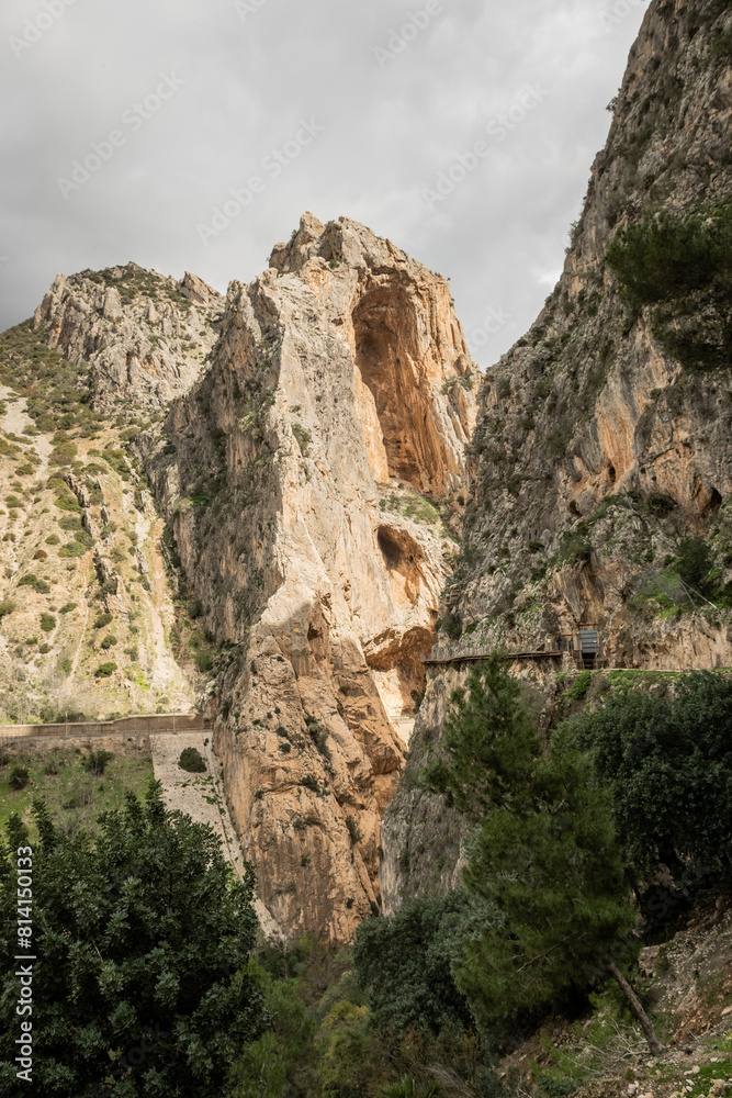 hiking trail caminito del rey, kings walkway, in Malaga Spain. narrow footpath leads through natural beauty mountain range cliff faces of gaitanes gorge. hisotric landmark popular tourist attraction