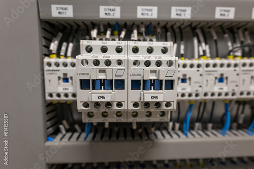 Photography A row of contactors in a switchboard next to each other.