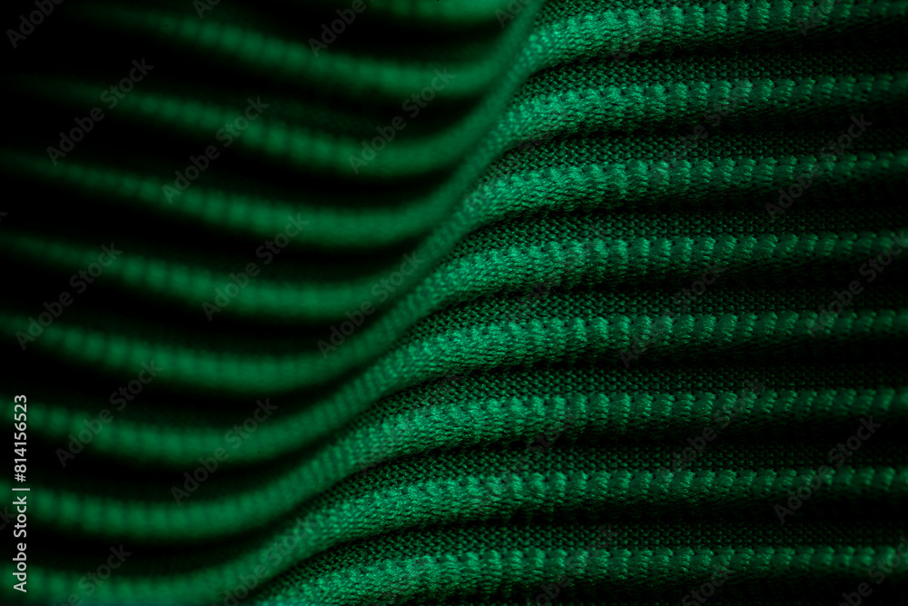Closeup of green corduroy cloth as patterned textured background Closeup of green corduroy cloth as patterned textured background