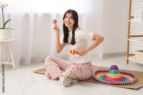 Young woman with sombrero a...
