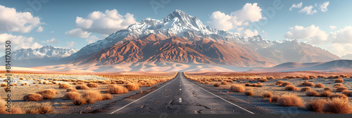 Desert Road Leading Towards Snow-Capped Mountain,
Continual road in a picturesque with distant mountain ranges
 photo