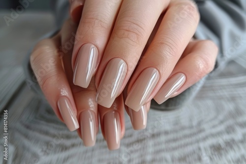 Elegant Long Coffin Nails with a Glossy Neutral Polish Finish 
