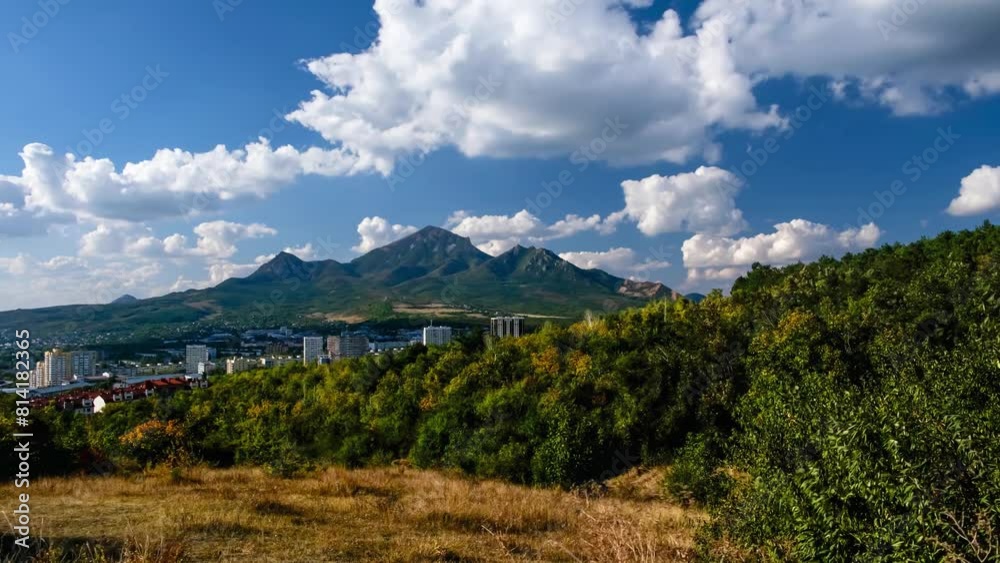 Time lapse, Movement of clouds over mountain peaks and city