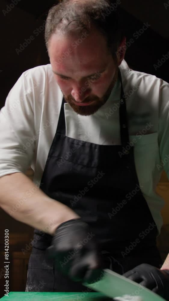 Chef Using A Knife For Slicing A Cuttlefish Chef Using A Knife For Slicing A Cuttlefish