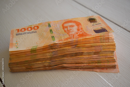 pile of 1000 argentine peso bills, symbol for inflation in Argentina