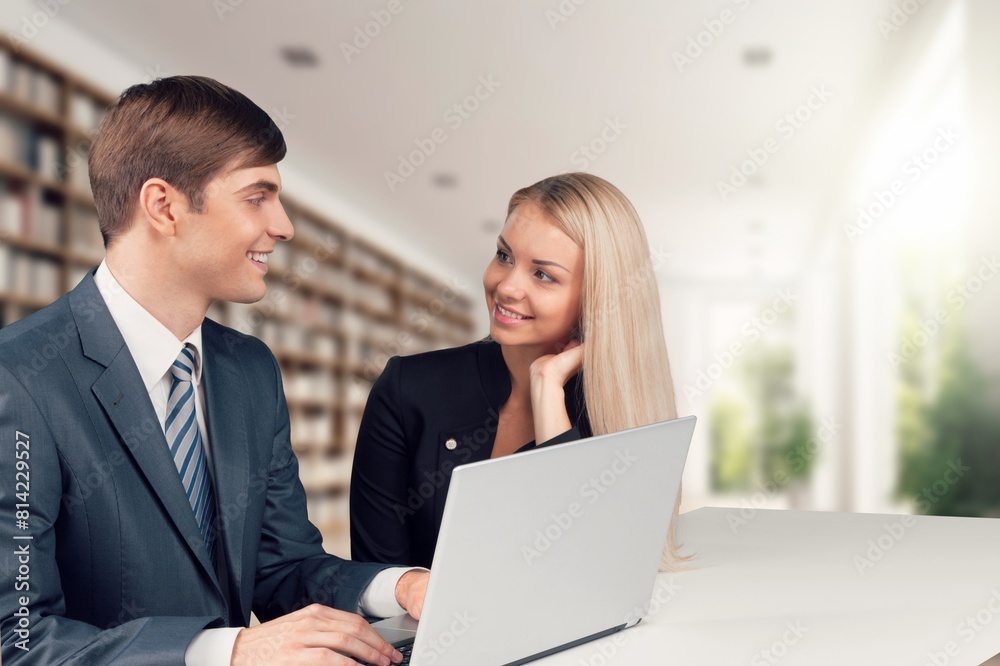 Professional business managers team working sitting at table. Professional business managers team working sitting at table.