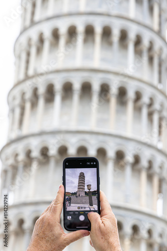 Tourist taking photo of Leaning Tower of Pisa