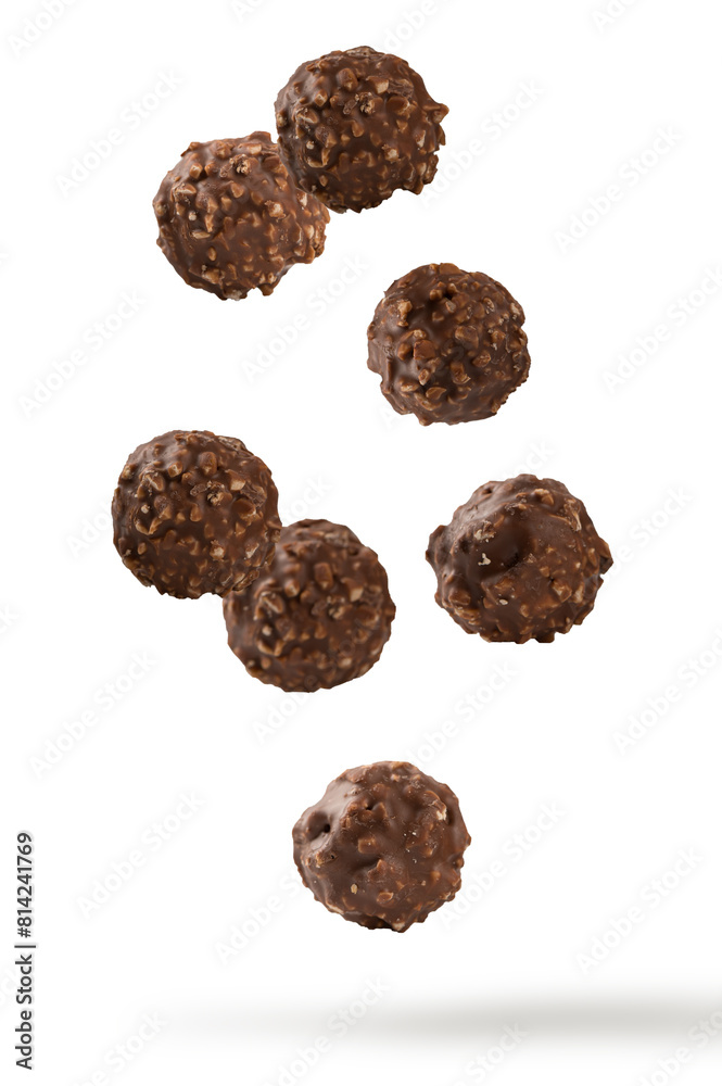 Chocolate ball candy falling in the air on white background. Chocolate ball candy falling in the air on white background.