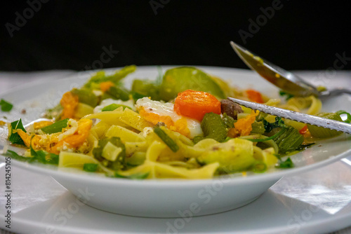 Traditional capeletti soup with chicken and vegetables. Typical winter dinner soup photo