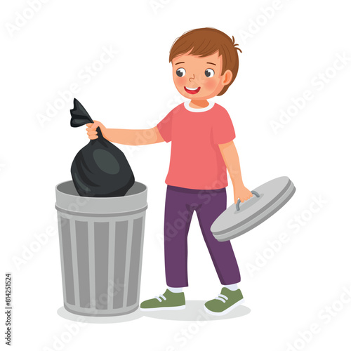 Cute little boy taking out the trash in garbage bag into recycling bin