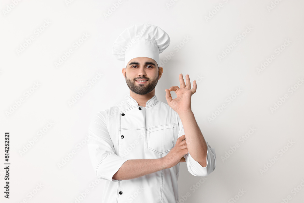 Professional chef with showing OK gesture on white background Professional chef with showing OK gesture on white background