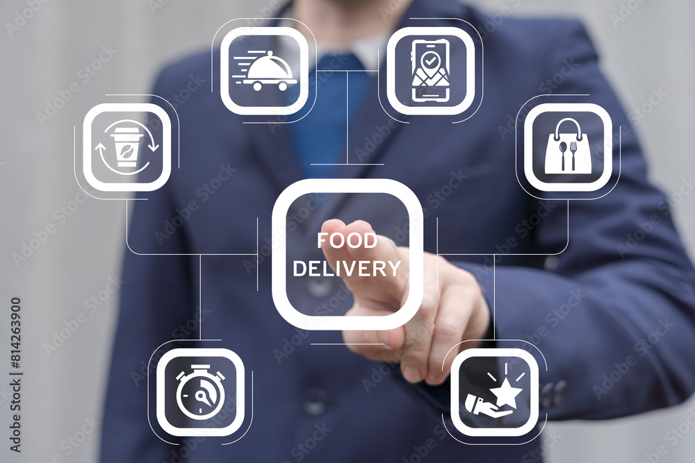 Courier working on virtual touch screen presses inscription: FOOD DELIVERY. Online food delivery service concept. Fast contactless food delivery home and office.