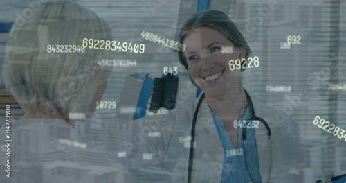 Image of numbers processing over caucasian female doctor with patient