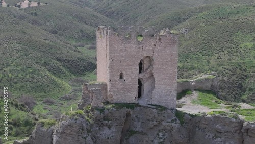 flight in reverse visualizing the castle of Oreja 9th century we see a deterioration in the tower, moving away we contemplate the spectacular situation of the castle in ravines Ontigola Toledo Spain photo