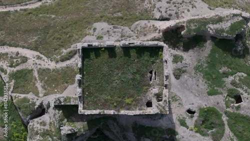 flight with a drone with a top-down view over the keep of the castle of Oreja 9th century we see the shadow of the battlements the earthen roof on the ground remains of its wall Ontigola Toledo photo