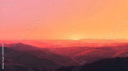 views of the hills and the orange sky from the light of the setting sun