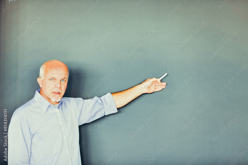 Senior teacher points marker, frustrated by misunderstanding Senior teacher points marker, frustrated by misunderstanding