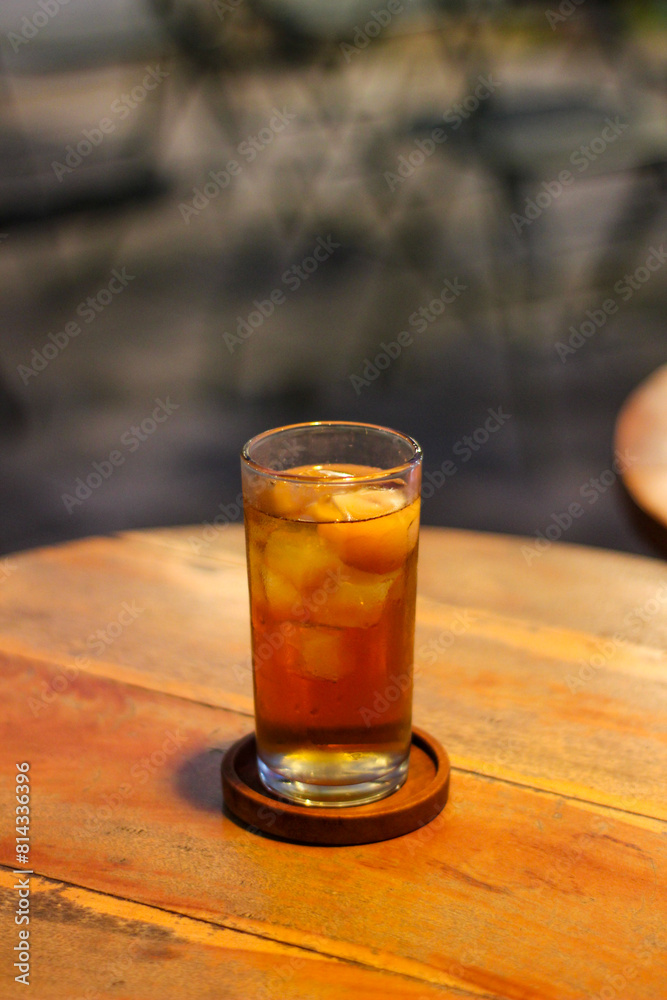 a glass of iced lychee tea on the table a glass of iced lychee tea on the table