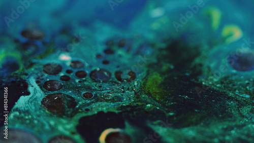 Paint bubbles. Oil fluid. Ink mix. Defocused blue green black color glitter foam texture emulsion blend flow abstract art background.