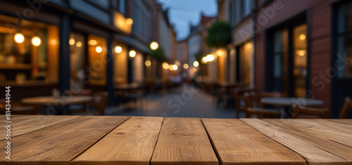 Empty wooden table in front of blurred cafe or restaurant, Food poster or menu display concept