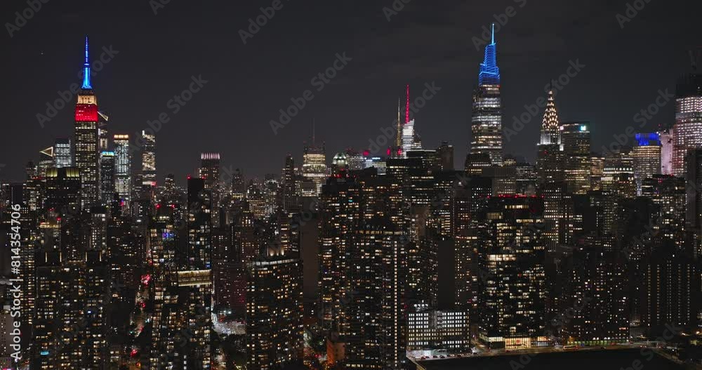 NYC New York Aerial v165 drone flyover East river capturing illuminated nighttime cityscape of Midtown Manhattan with dense and glittering skyscrapers - Shot with Inspire 3 8k - September 2023