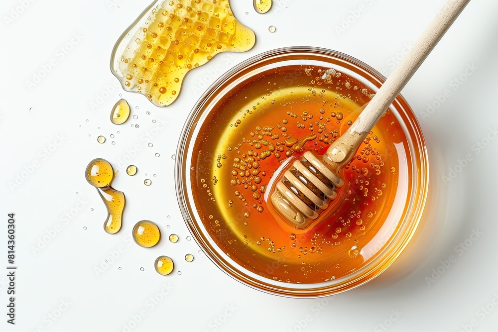 Glass bowl of honey with honey dipper isolated on white background. top view Glass bowl of honey with honey dipper isolated on white background. top view