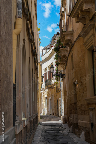 Narrow quiet street in the golden city of Lecce Italy