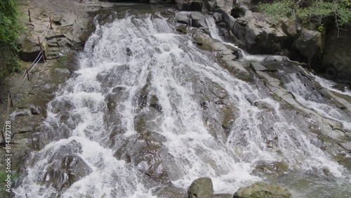 the Goa Rang Reng waterfall in Bali, Indonesia. High angle wide shot. photo