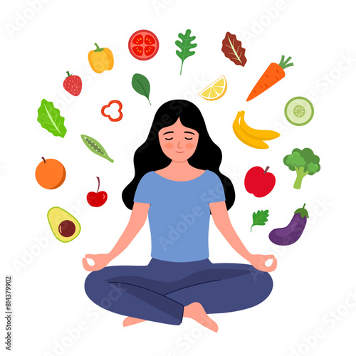 Mindful eating concept. Young woman meditating surrounded by healthy vegetables and fruits. Healthy daily diet and balanced lifestyle.