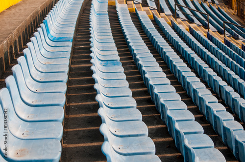 Empty seats in a soccer stadium in Latin America, a structure built amidst a ravine, providing space for both sporting and musical events. © Byron Ortiz