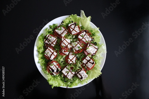 salad tomatoes cheese greens sauce seasonings