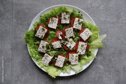 salad tomatoes cheese greens sauce seasonings