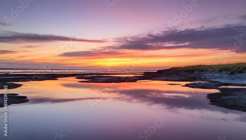 A colorful sunset reflected in the calm waters of upscaled_4