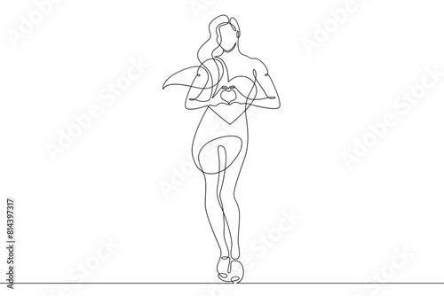 One continuous line.Beautiful woman holding a heart in her hands.Valentine's Day. Girl with a heart symbol of love. Continuous line drawing.Lineart isolated white background.