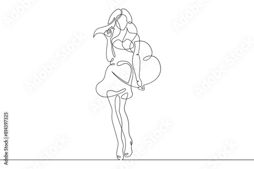 One continuous line.Beautiful woman holding a heart in her hands.Valentine's Day. Girl with a heart symbol of love. Continuous line drawing.Lineart isolated white background.