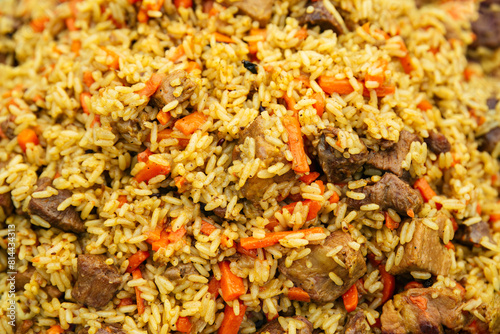 national dish of oriental cuisine of Central Asian countries pilaf (plov) with pork and beef meat