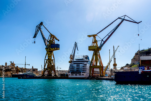 Huge Ship yard cranes in Malta. Valletta has a deep sea port for shipping and massive dry docks for ship yard works.