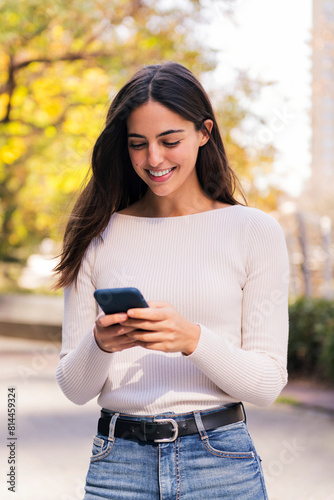 caucasian woman smiling happy using mobile phone