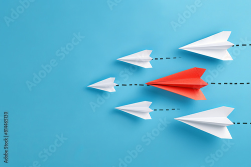 red paper plane leading white ones, leadership concept
 photo