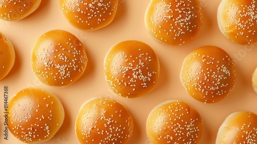 Artistic top view of golden sesame seed buns, focusing on their soft and fluffy texture, perfect for burger advertising, isolated background