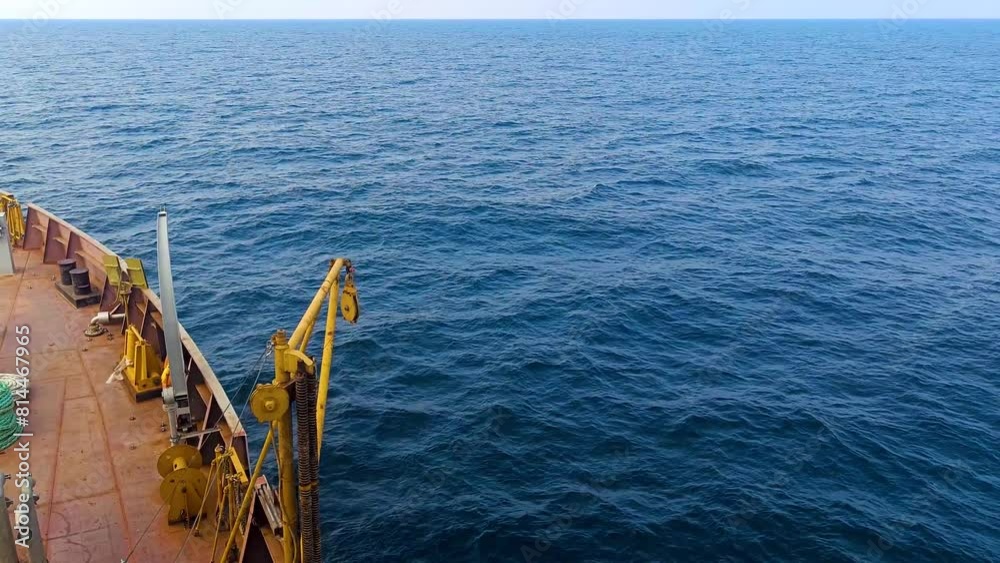 Ship sailing in blue sea in daytime. Top view of ocean. Ship sailing in blue sea in daytime. Top view of ocean.